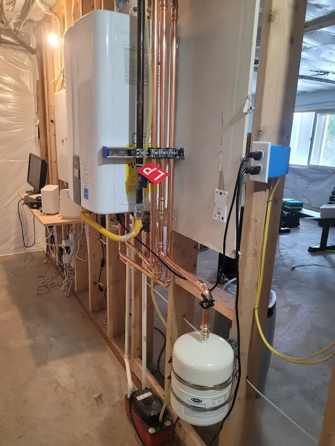 Licensed plumber repairing a kitchen sink in Hooper